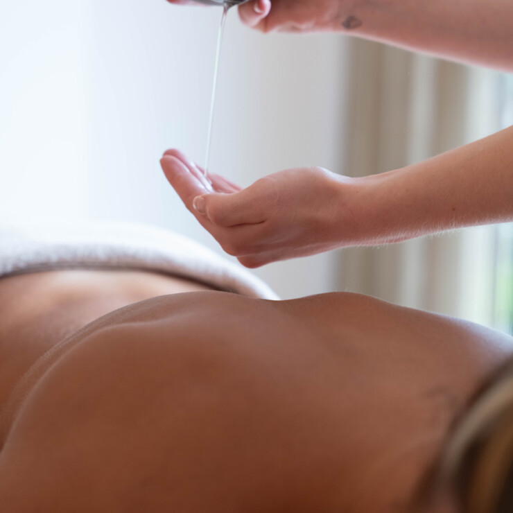 Back Massage with Oil in the hand