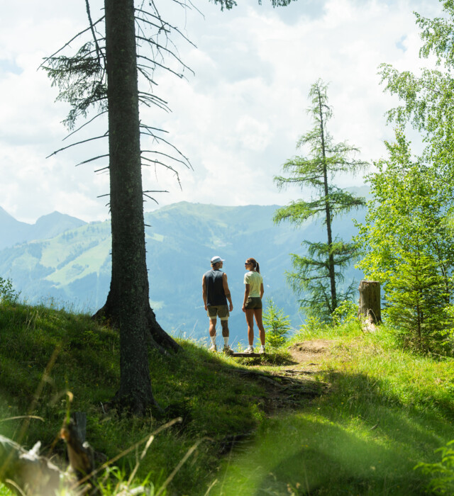 Couple is enjoying the view of the mountains