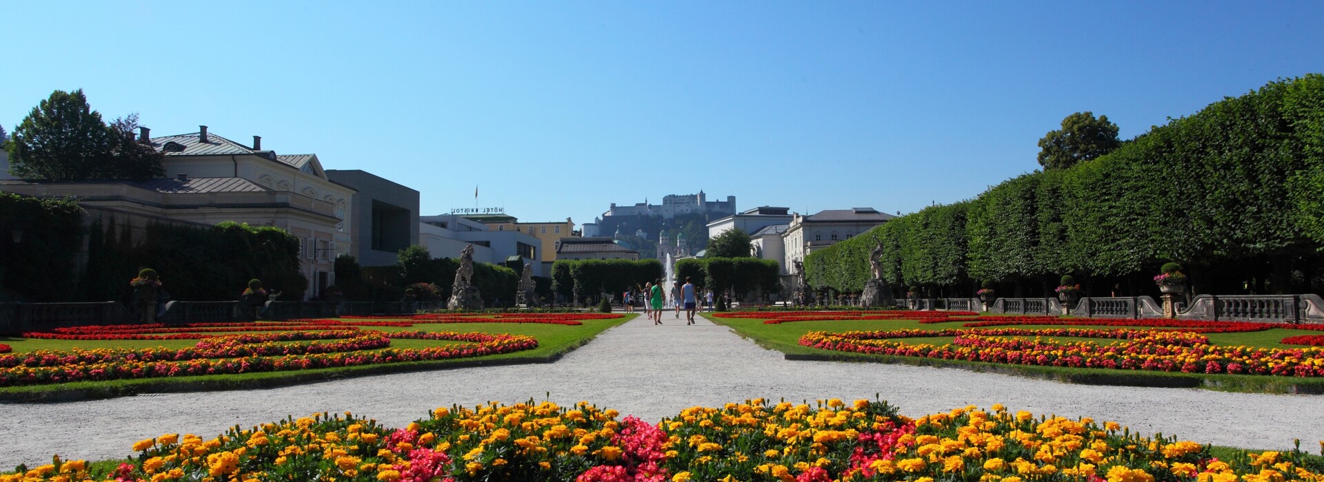 Mirabell Garden view Salzburg with flowers and blue sky